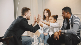 Young parents had troubles in their relationship. The daughter was depressed. Pshycoterapist solved the problem and clapping hands with the girl.