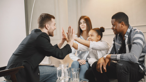 Young parents had troubles in their relationship. The daughter was depressed. Pshycoterapist solved the problem and clapping hands with the girl.