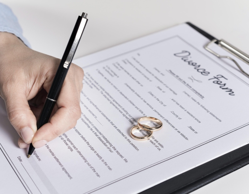 close-up-man-signing-divorce-form