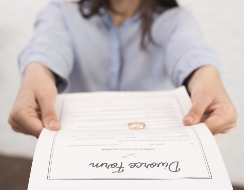 close-up-woman-holding-divorce-form